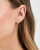 large gold stud earring with diamond in the middle