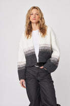 open cardigan with white top.that fades into black