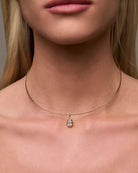 gold collar necklace with pear shaped pendant 