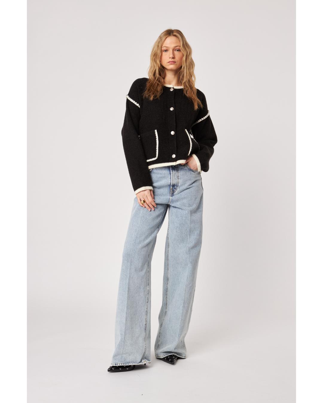 black cardigan with white stitching