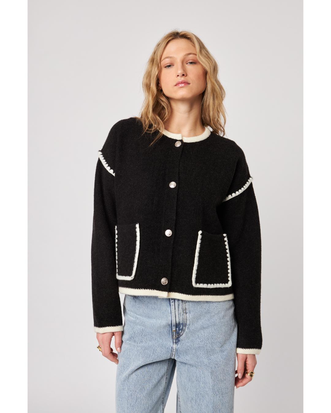 black cardigan with white stitching