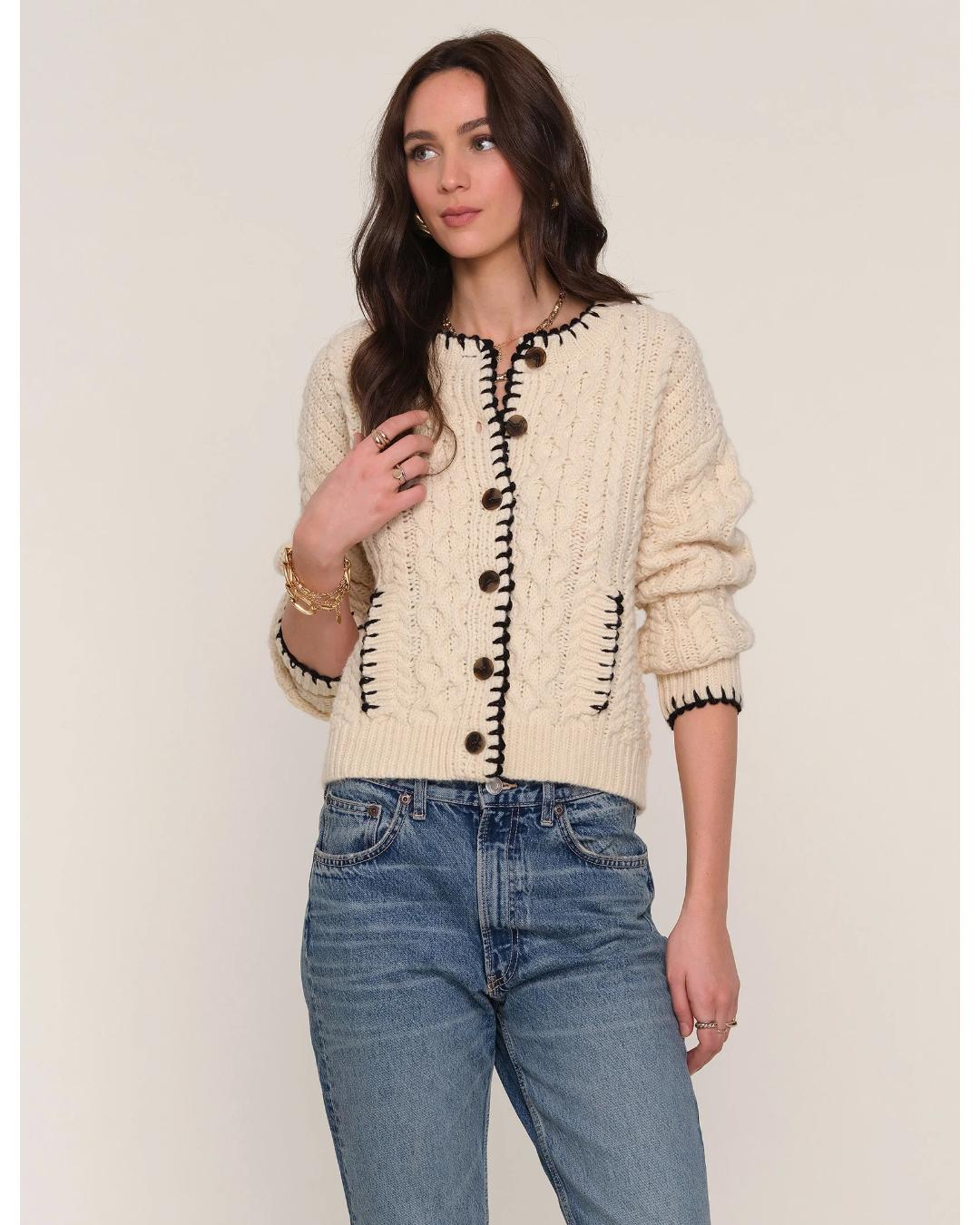 cream cardigan with black stitching outline