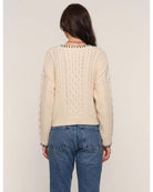 cream cardigan with black stitching outline
