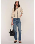 cream cardigan with black stitching outline
