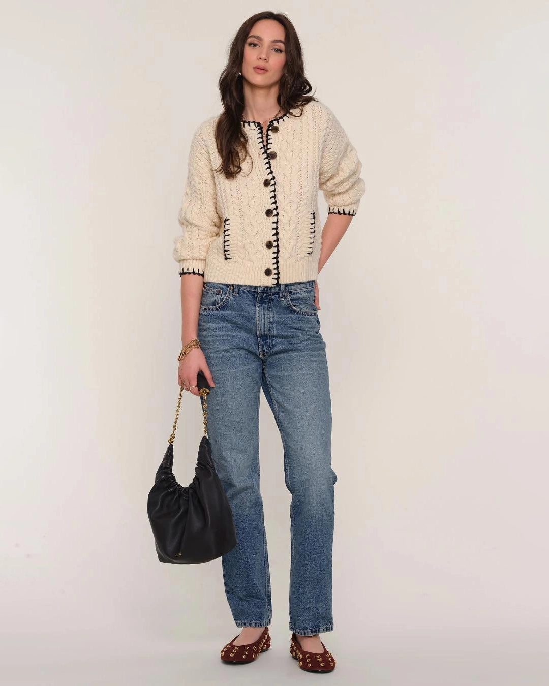 cream cardigan with black stitching outline