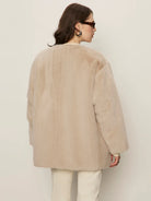 beige coloured fur coat
