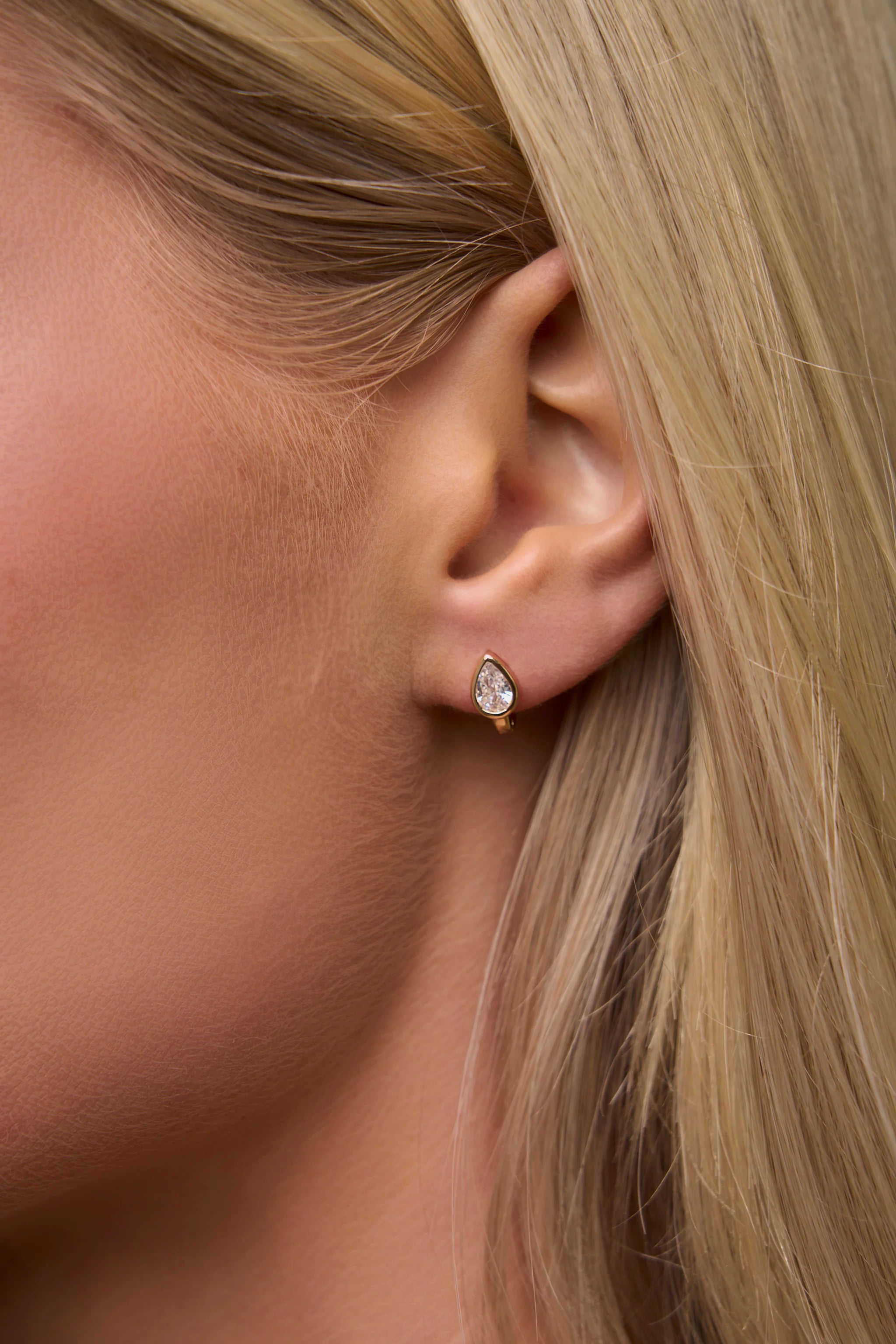 pear shaped gold huggie earring