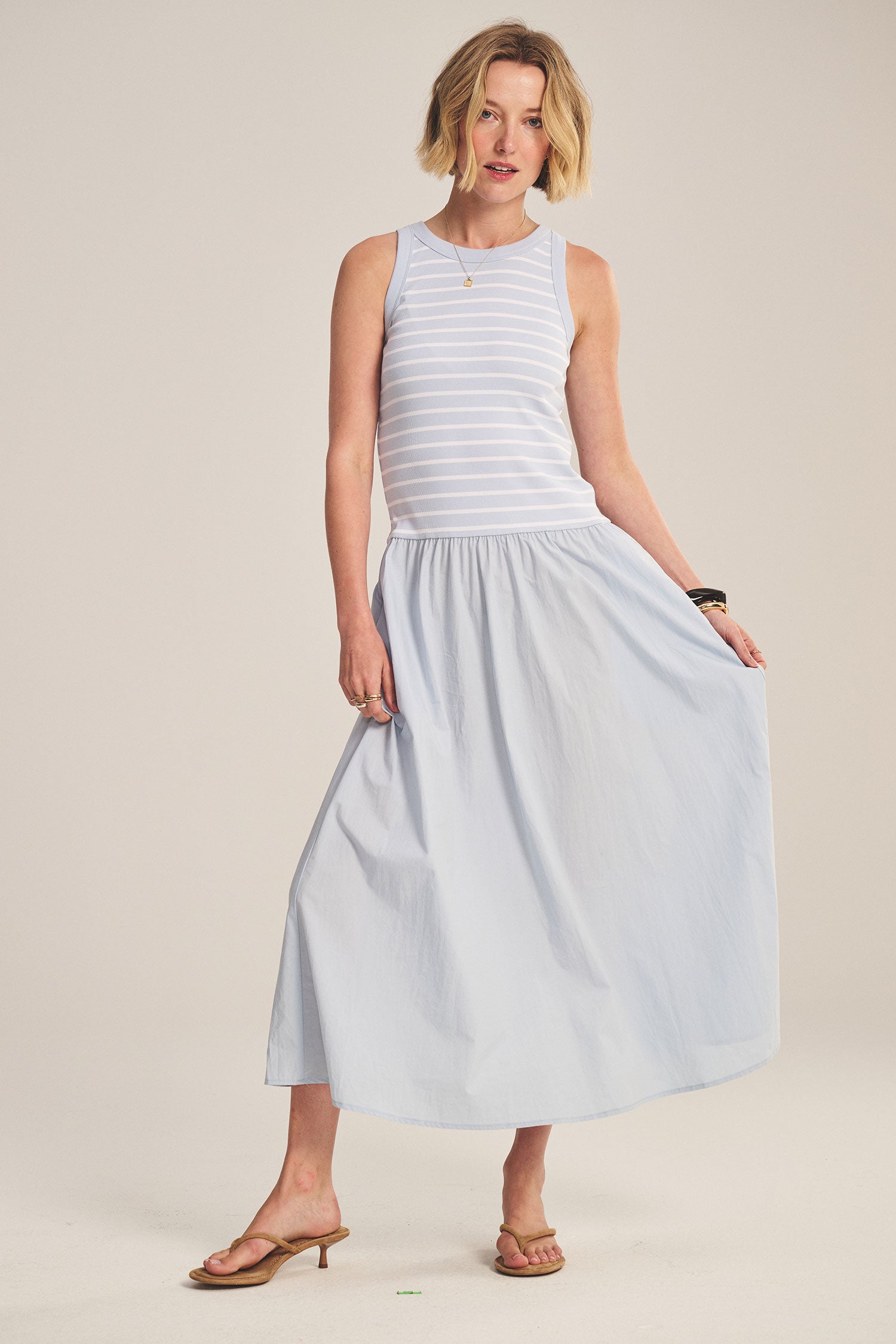 blue midi dress with a striped top and flowy bottom