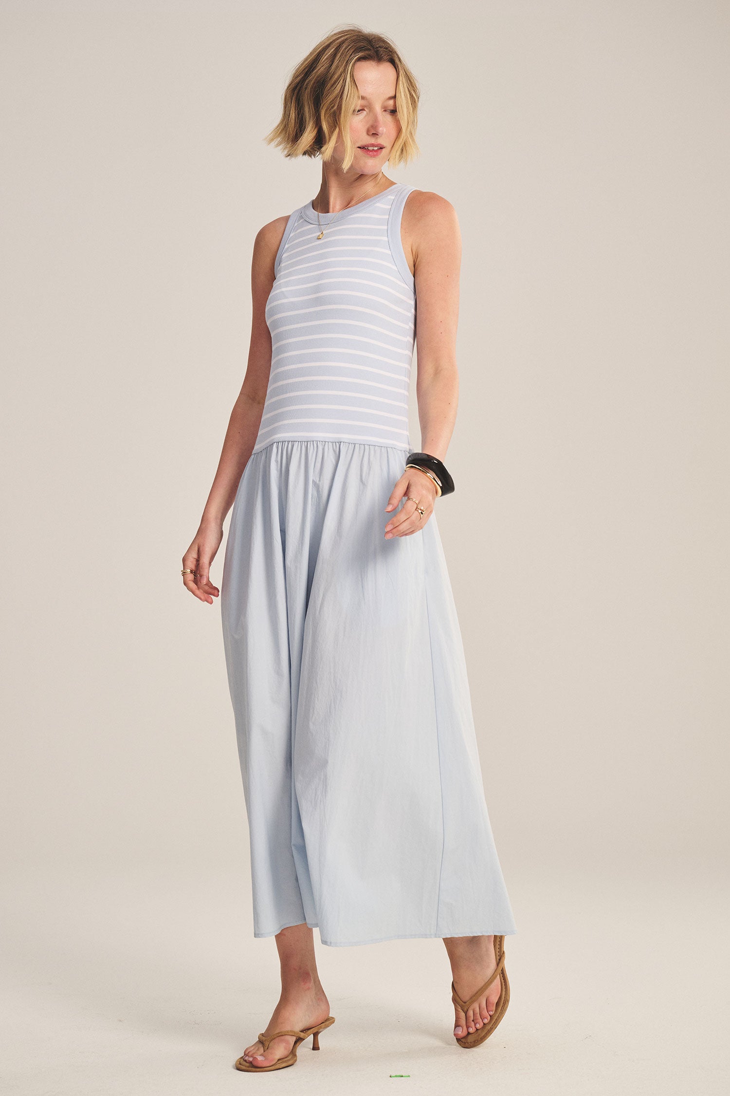 blue midi dress with a striped top and flowy bottom