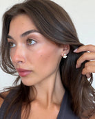gold earrings with white detail