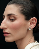 silver earrings with white detail