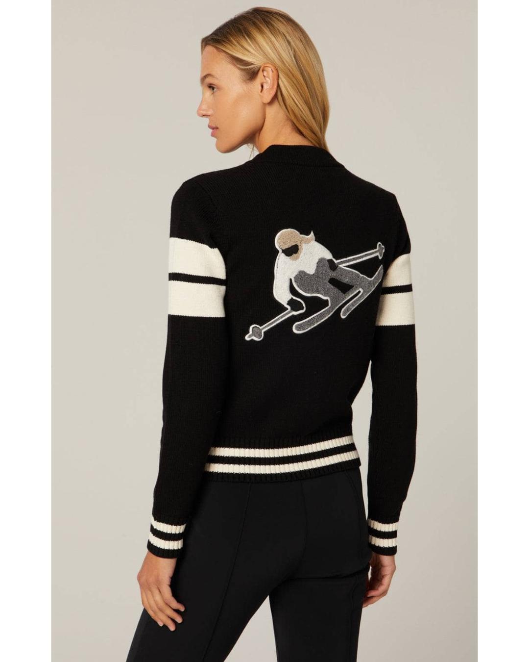 black zip up sweater with a skiier on the back