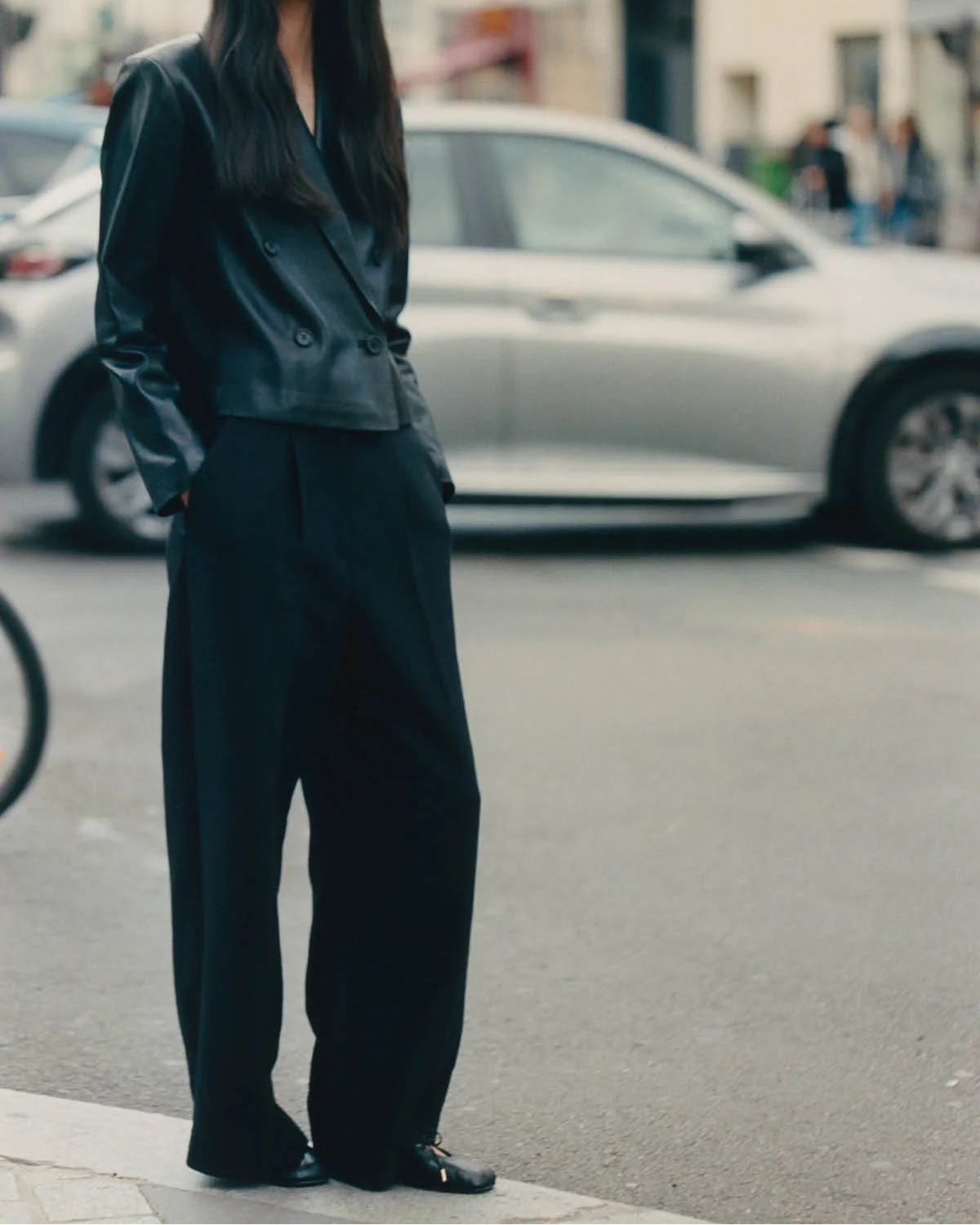 black leather ballet flats with a cut out and bow