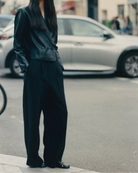 black leather ballet flats with a cut out and bow