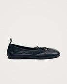 black leather ballet flats with a cut out and bow