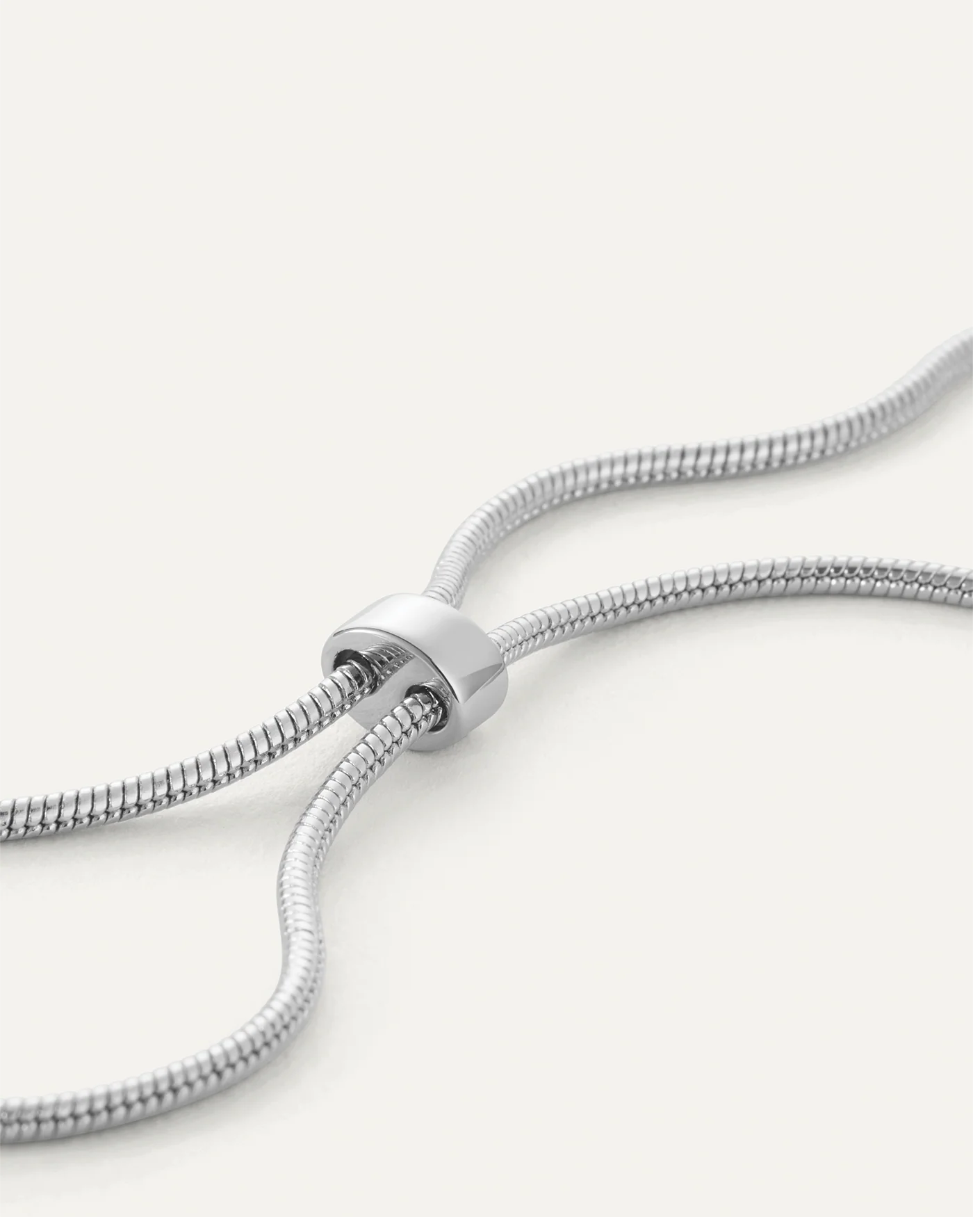 necklace with a statement solver pendant on a long thick silver chain