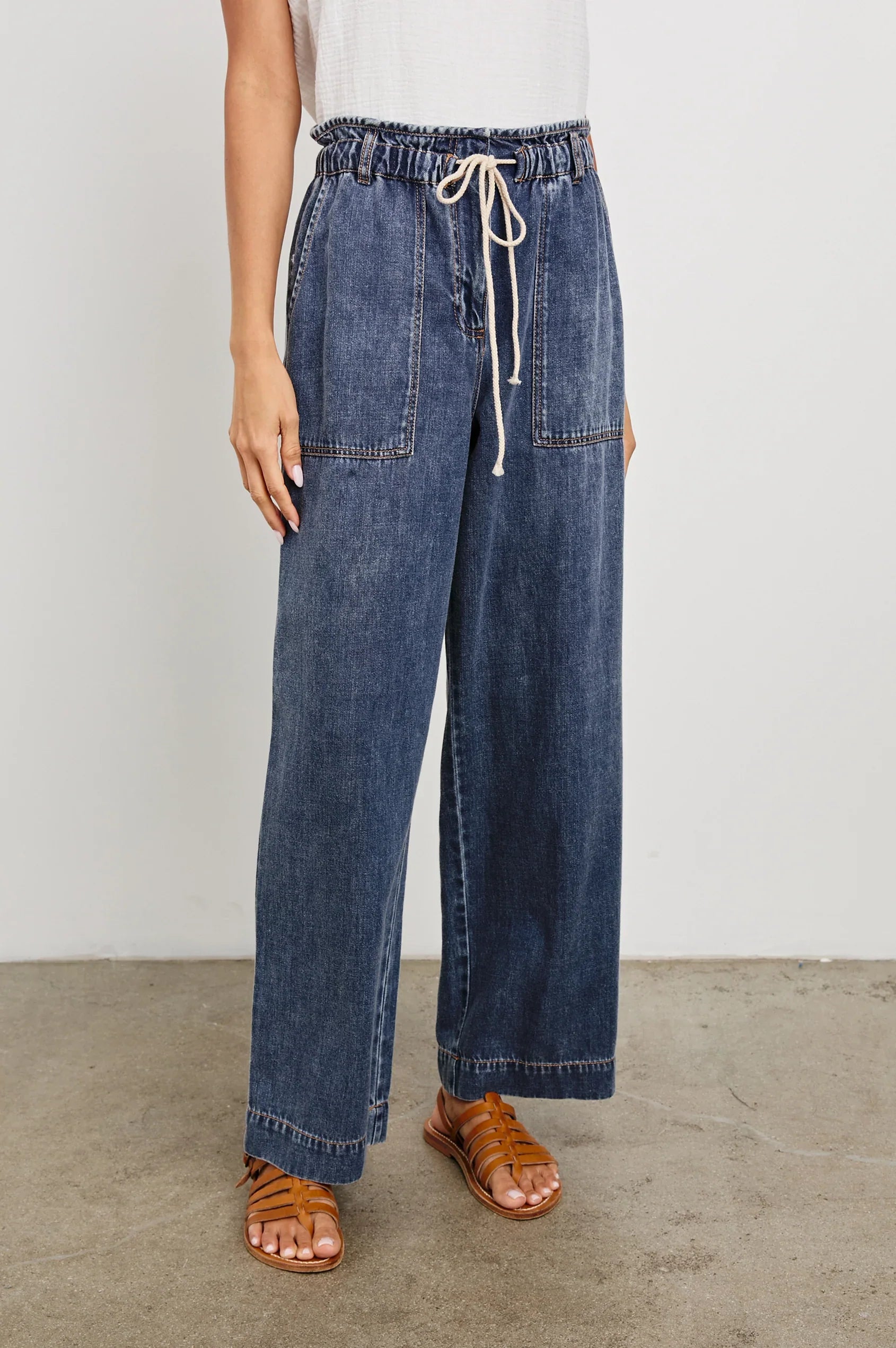 dark blue wide leg jeans with a tie waist band