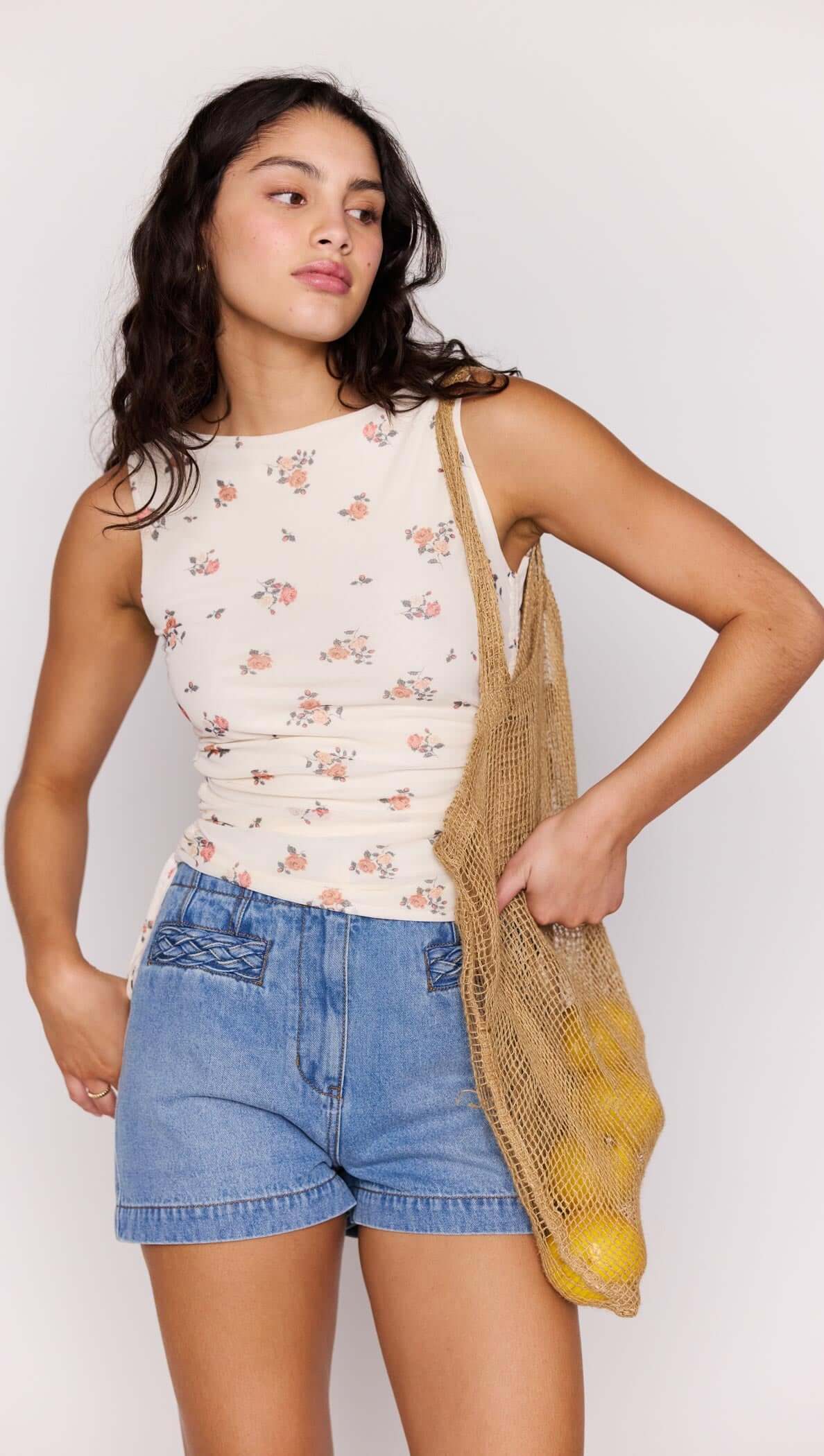 mesh cream tank top with a floral print
