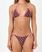 brown bikini top with pink polka dots and a lace trim