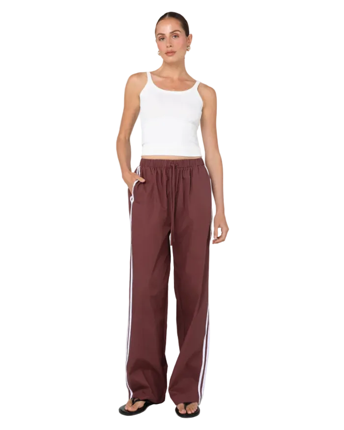 sporty pant in burgundy with cream stripe down the side