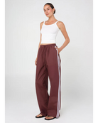 sporty pant in burgundy with cream stripe down the side