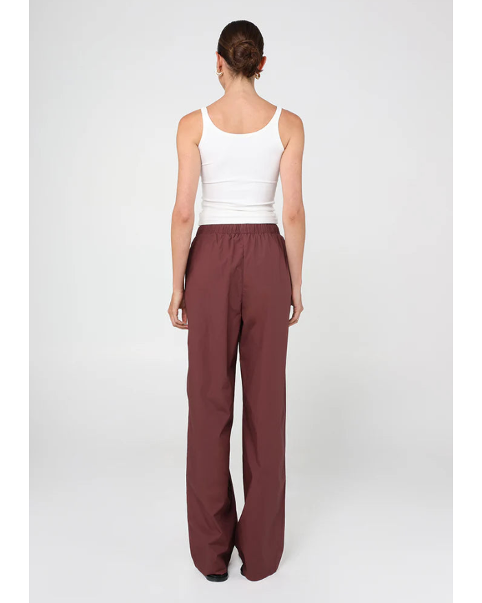 sporty pant in burgundy with cream stripe down the side