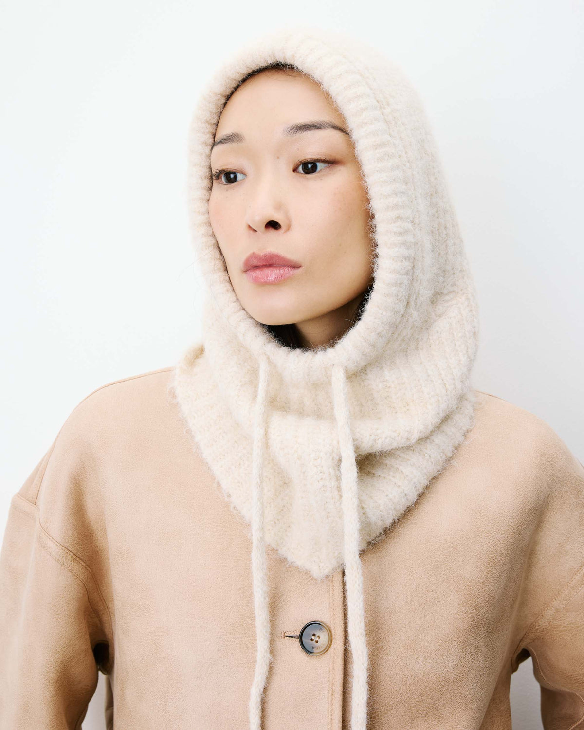 beige knit balaclava with a tie