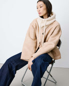 beige knit balaclava with a tie