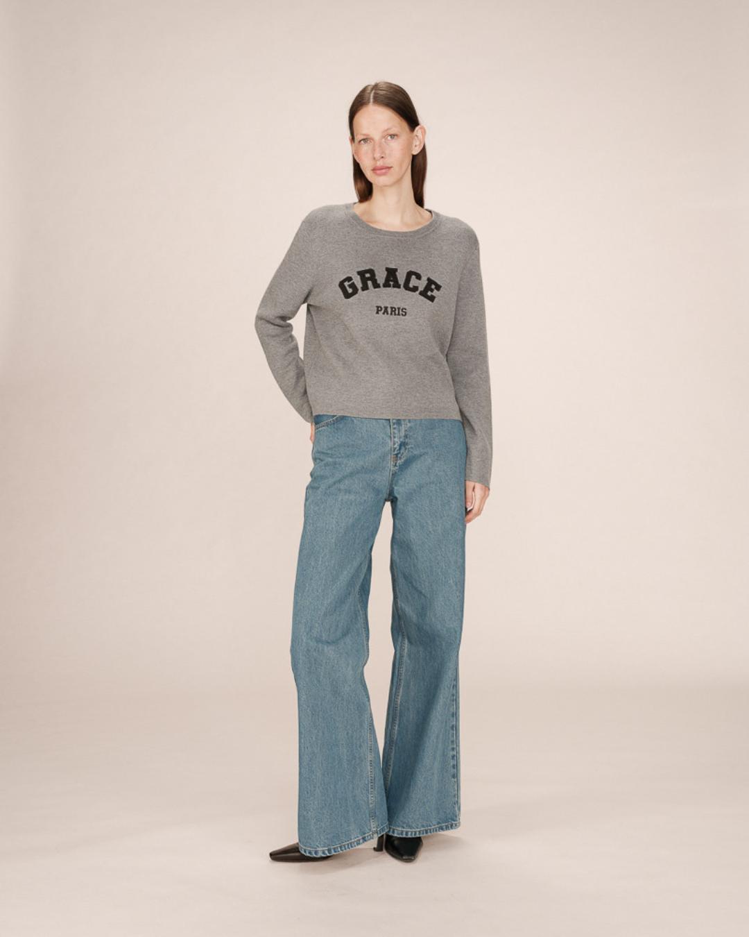 grey crewneck with grace paris written on the chest
