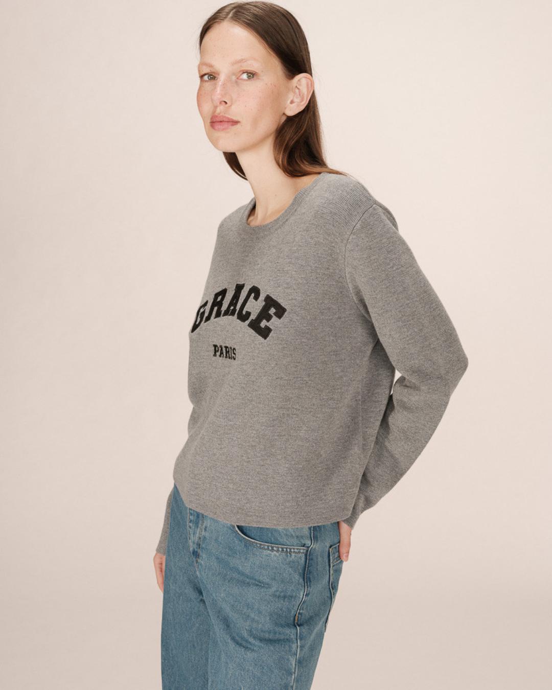 grey crewneck with grace paris written on the chest