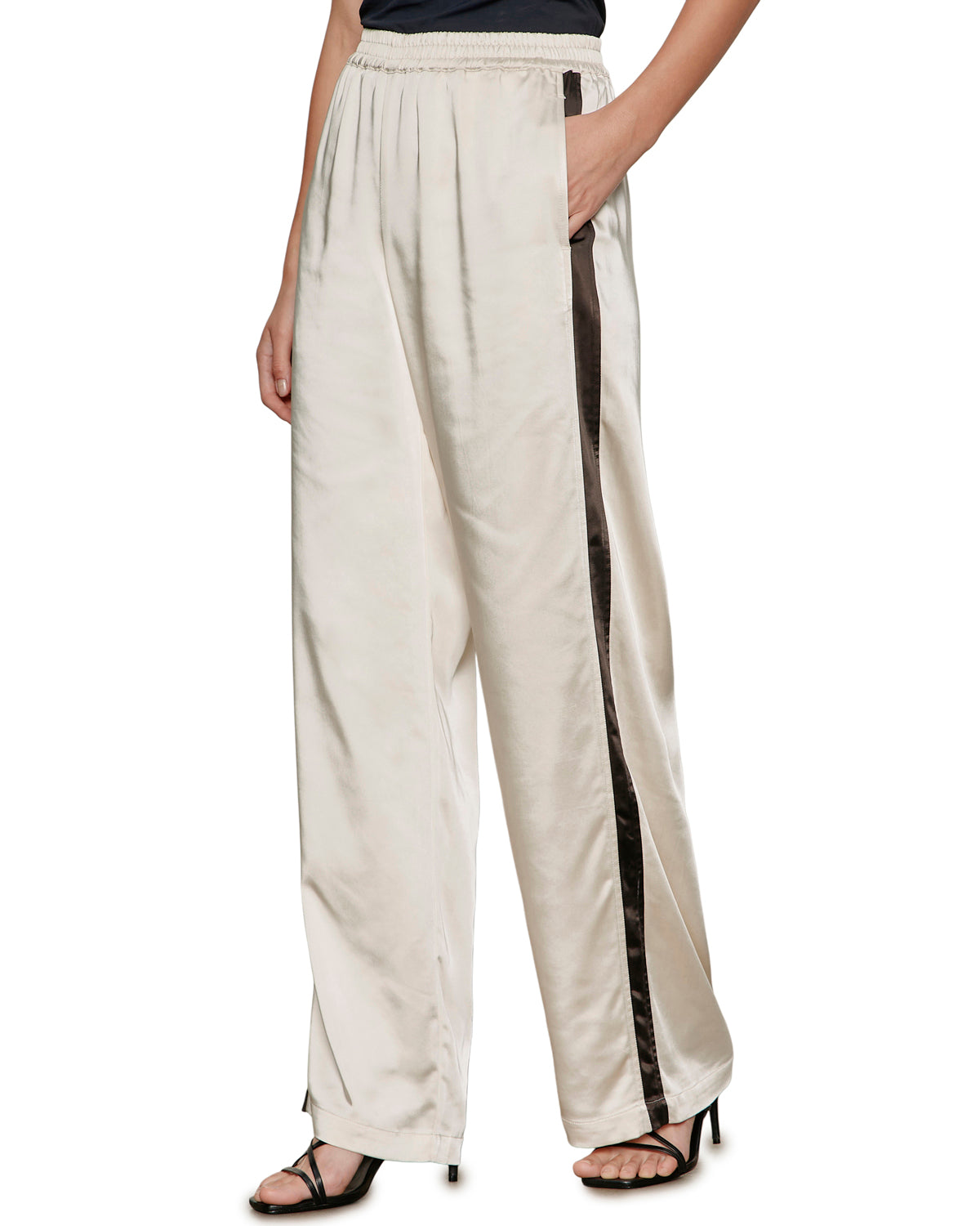 satin wide leg pant in beige with a black stripe down the side
