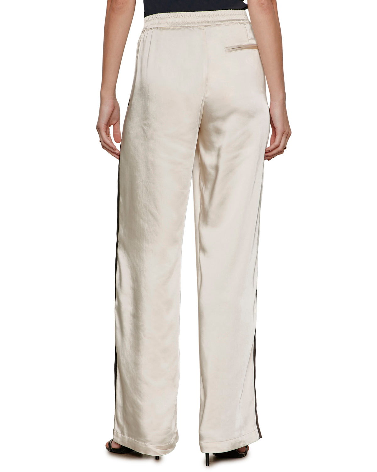 satin wide leg pant in beige with a black stripe down the side