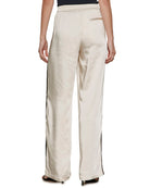 satin wide leg pant in beige with a black stripe down the side