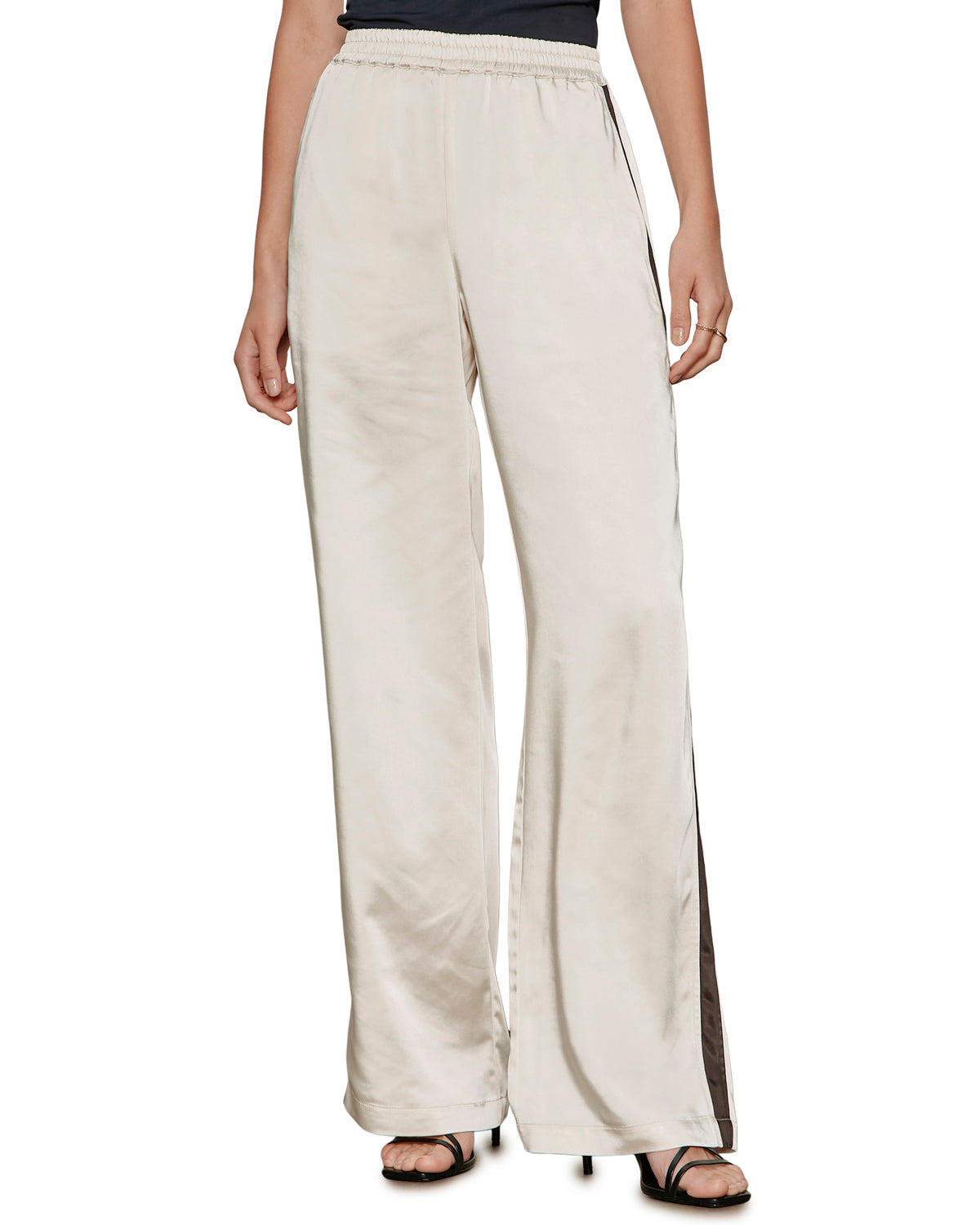 satin wide leg pant in beige with a black stripe down the side