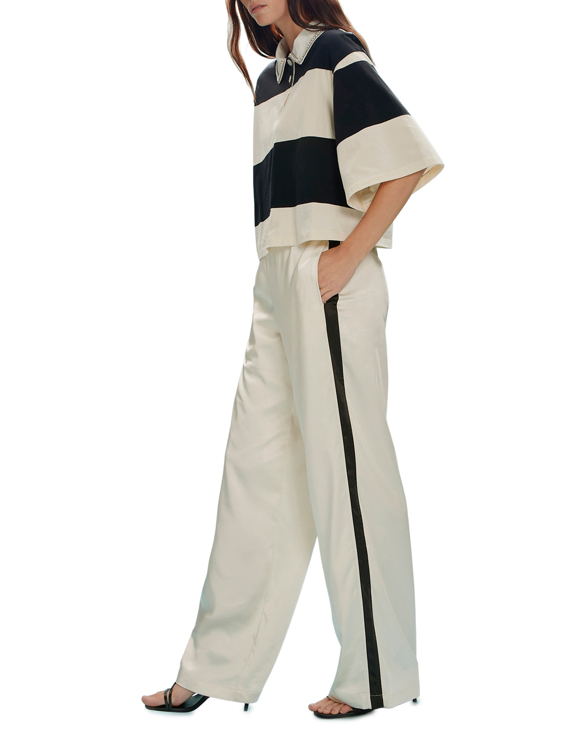 satin wide leg pant in beige with a black stripe down the side