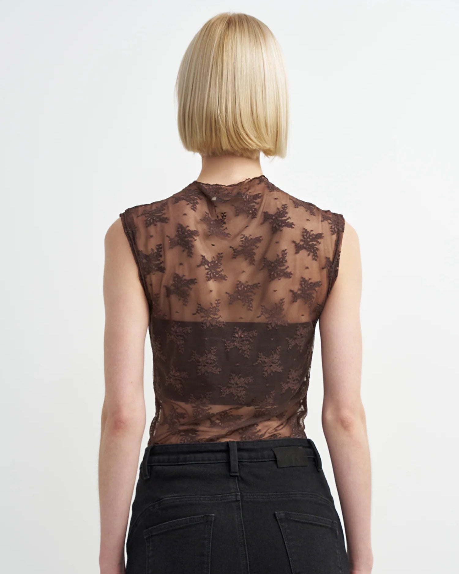 brown sleeveless sheer top with details all over