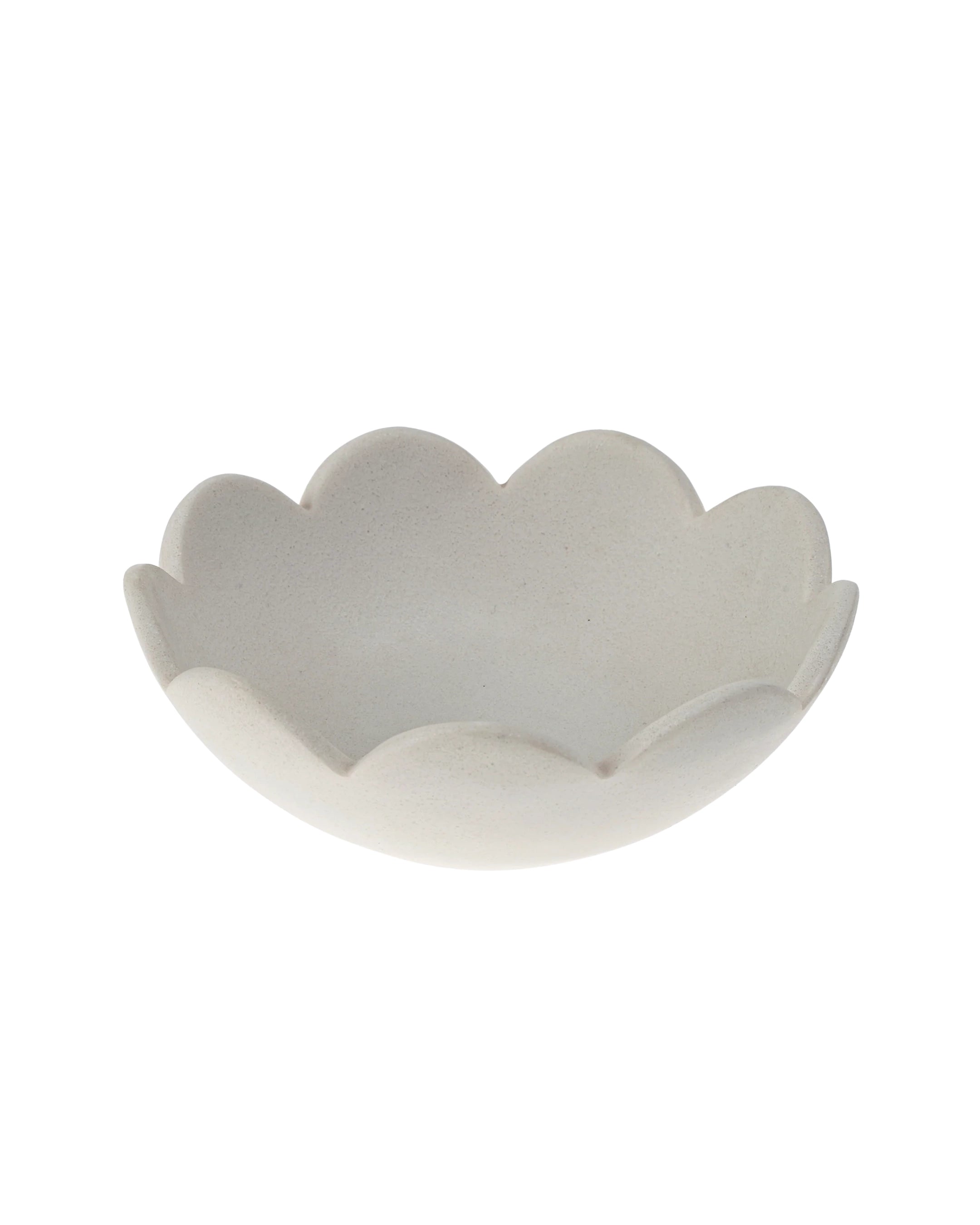 a scalloped decorative marble bowl in white