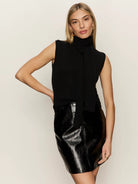 black turtleneck sleeveless shirt with a built in scarf