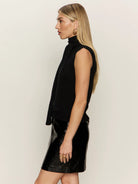 black turtleneck sleeveless shirt with a built in scarf