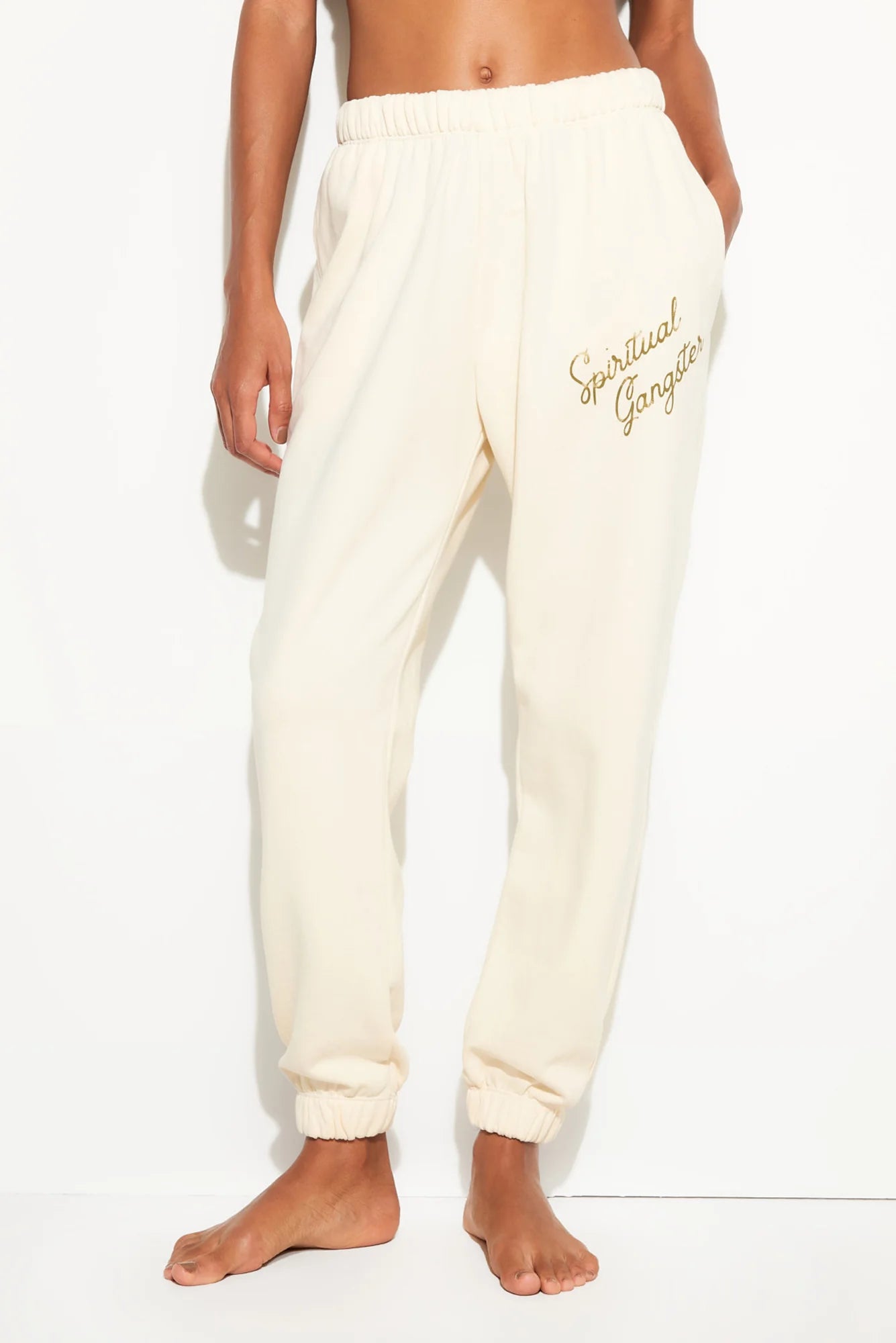 cream sweatpants what say spiritual gangster on the leg
