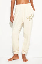 cream sweatpants what say spiritual gangster on the leg