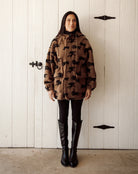 brown parka jacket with brow horses 