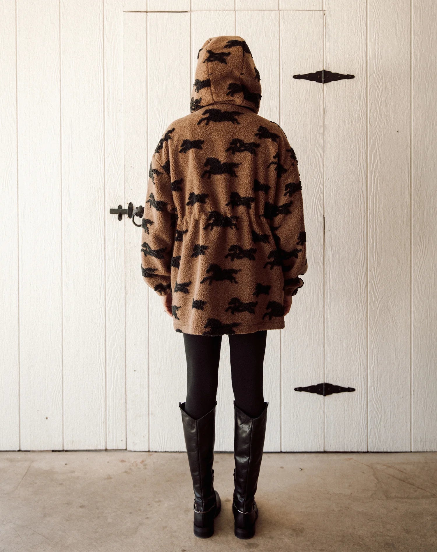 brown parka jacket with brow horses 