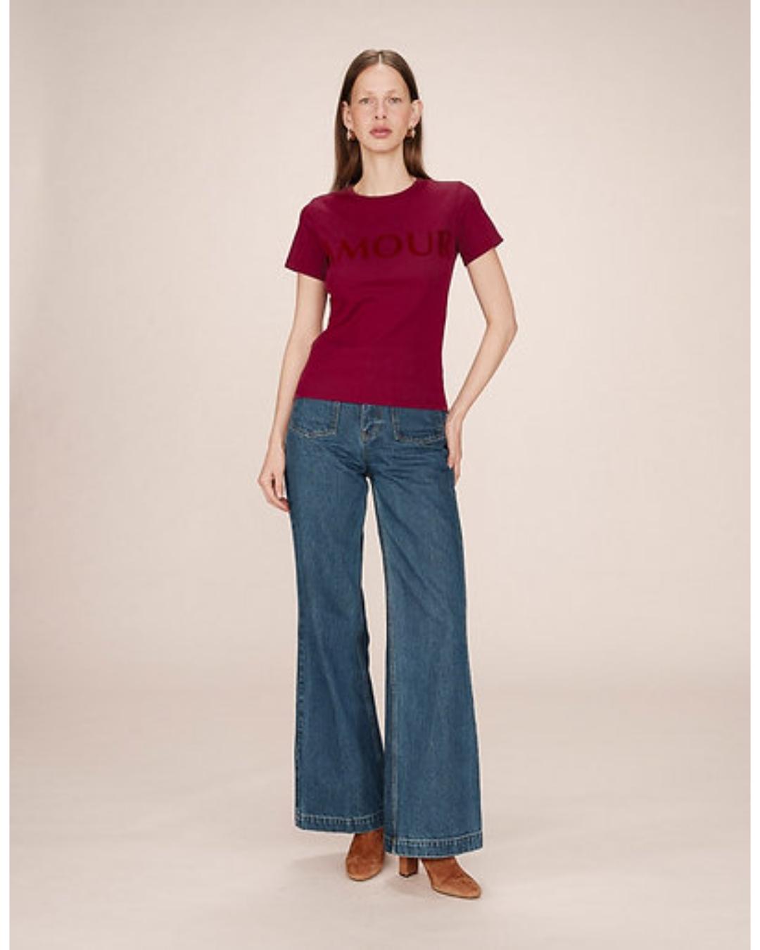 red t-shirt with amour written across the chest