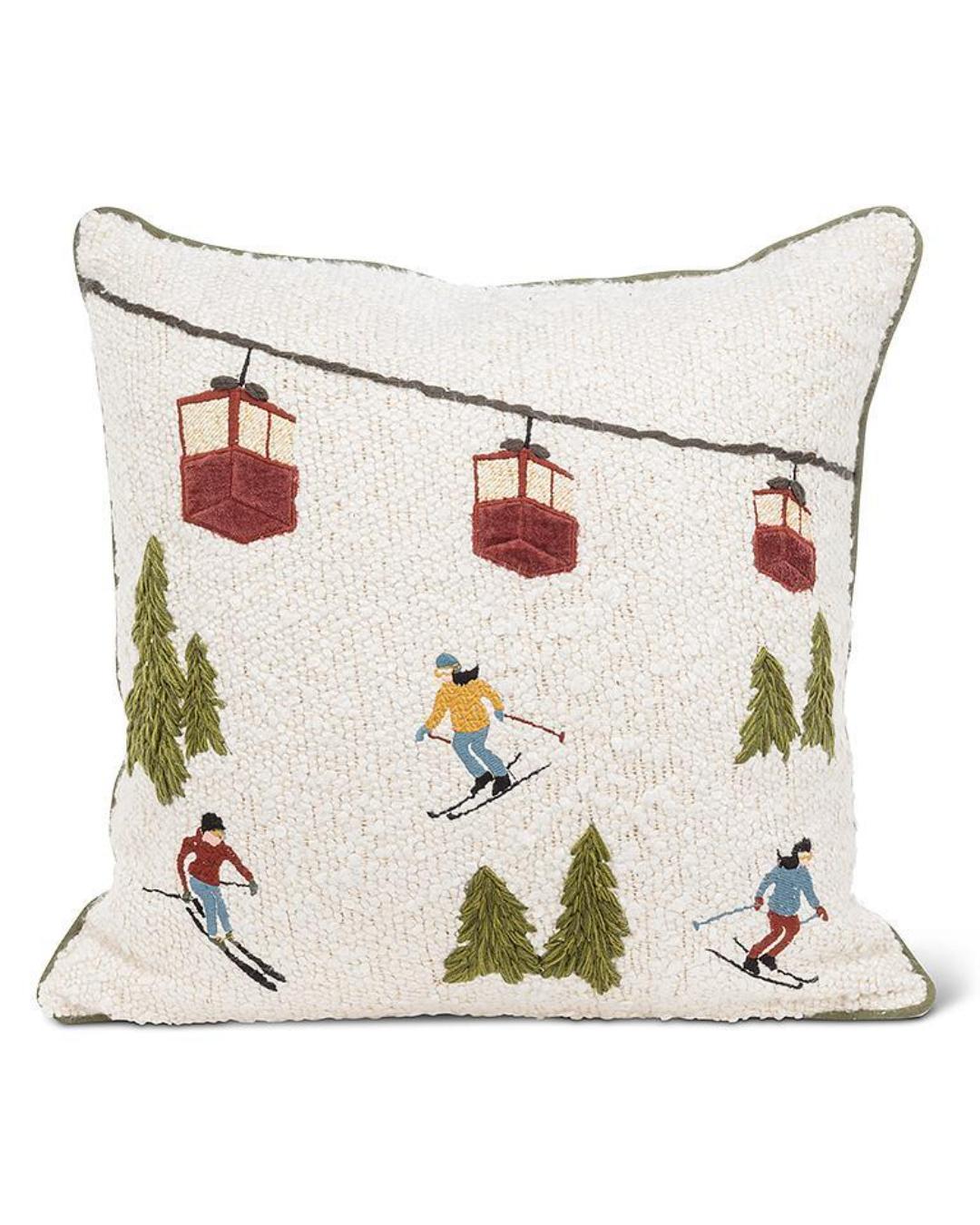 square pillow in white with a ski scene design