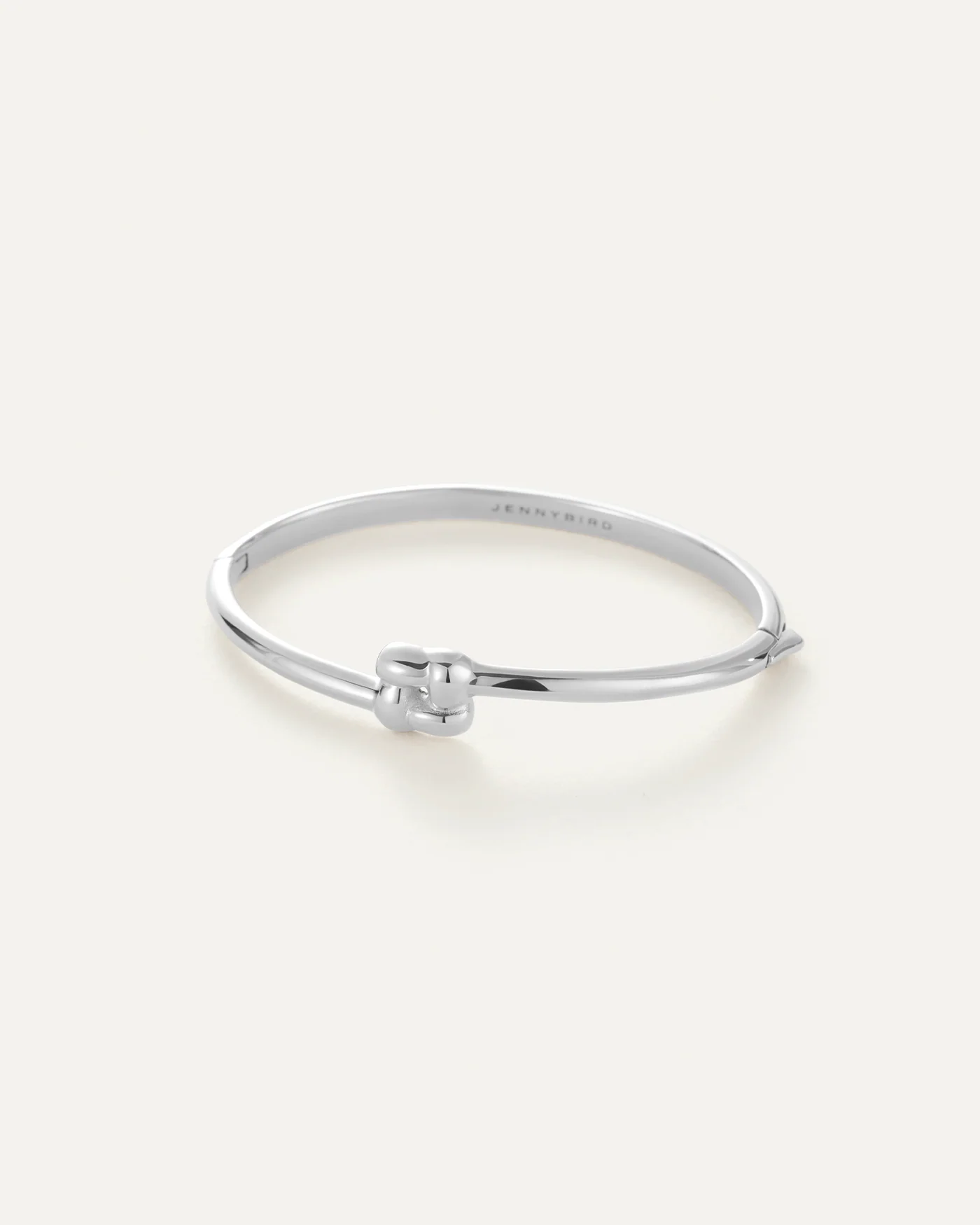 silver bangle with a square woven pendant