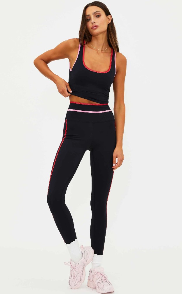 black leggings with a pink and red stripe down the side
