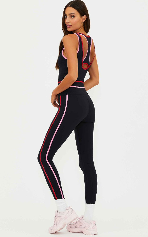 black leggings with a pink and red stripe down the side