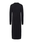 Woman wearing a black knit v neck dress