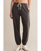 washed black sweatpants with a white rope tie